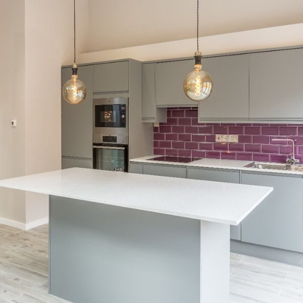 Kitchen renovation with neutral coloured walls and centre kitchen island